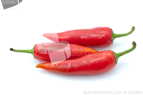 Image of Three red chili peppers