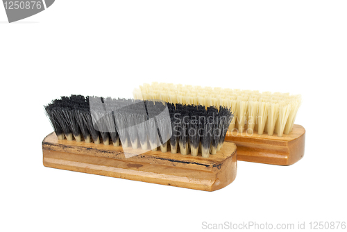 Image of New and used (dirty) clothes (or shoe) brushes