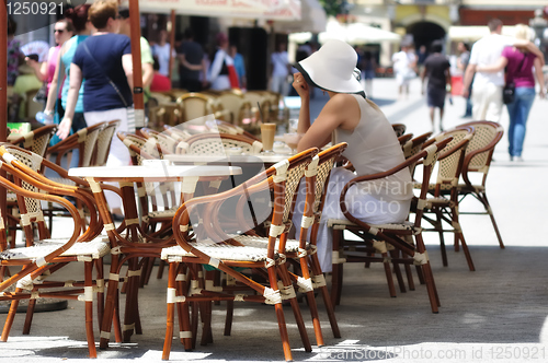 Image of Girl in street bar