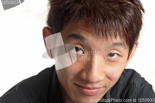 Image of Chinese men face the camera smiling 
