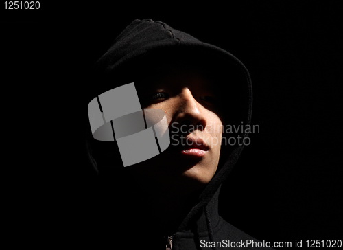 Image of Monochrome picture of a guy in a hood 