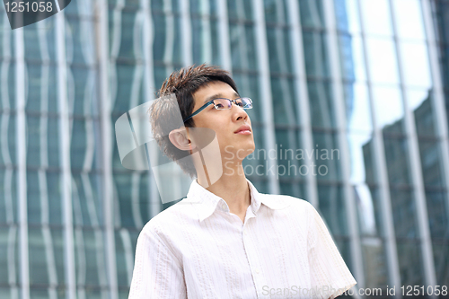 Image of asian young, handsome business man at the office building . 