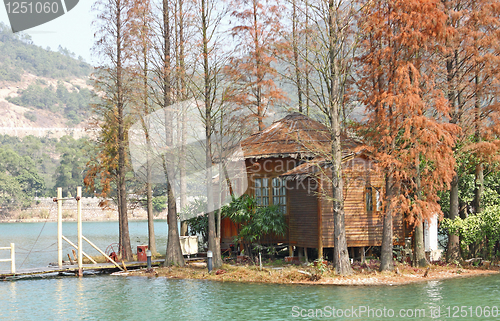 Image of wood house on water