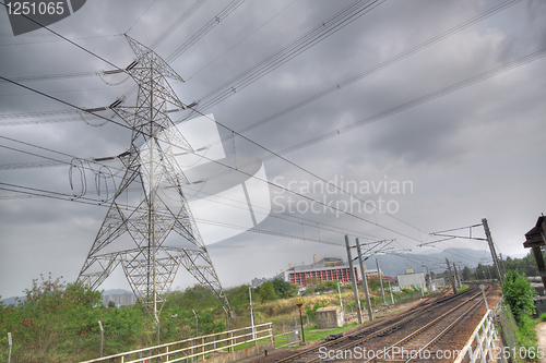 Image of train track and power tower