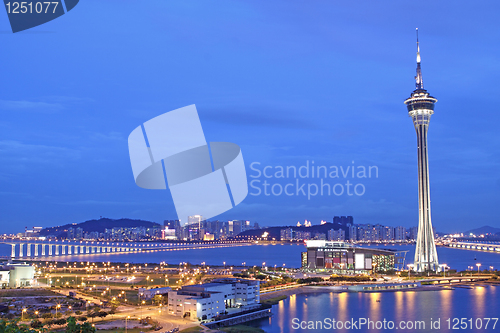 Image of Urban landscape of Macau with famous traveling tower under sky n