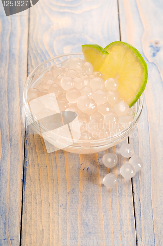 Image of tapioca pearls with lime. white bubble tea ingredients