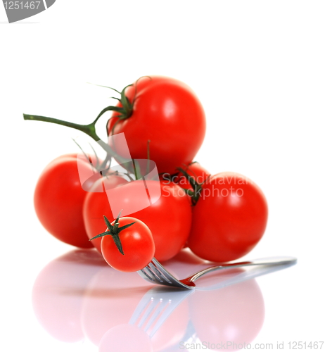 Image of Red tomato on a fork.