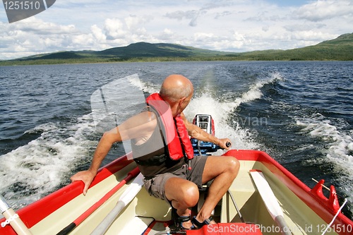 Image of Man in motor boat