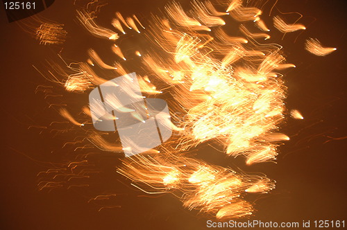 Image of Yellow firework flies