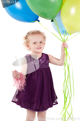 Image of Little cute girl with multicolored air balloons