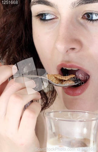 Image of Young people eating milk with cereals