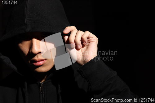 Image of Monochrome picture of a guy in a hood 