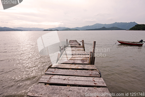 Image of old jetty walkway pier the the lake 