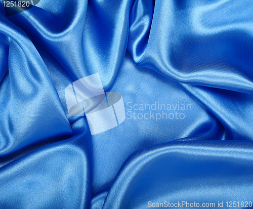 Image of Smooth elegant blue silk as background 