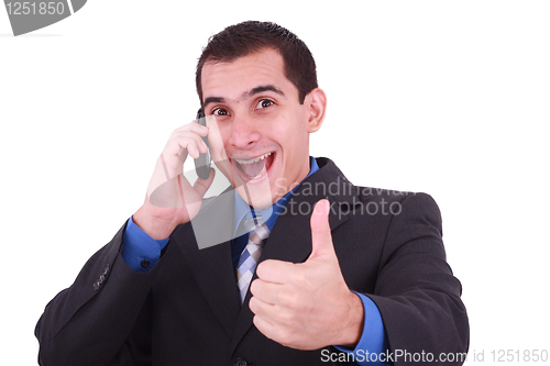 Image of Isolated Image of a Handsome Hispanic Businessman Giving Thumbs Up