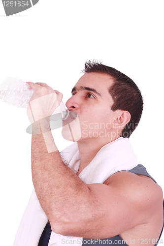Image of Man drinking water after the gym 