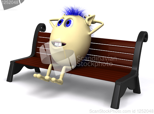 Image of Haired puppet resting on brown park bench