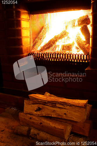 Image of Foto of warm fireplace at late evening