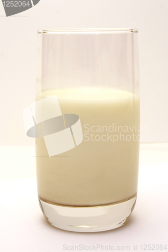 Image of Glass with milk on smooth white table