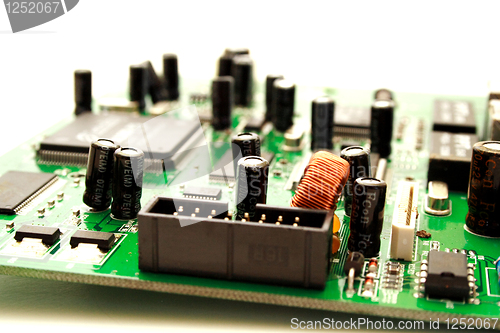 Image of Foto of green computer circuit board transistors