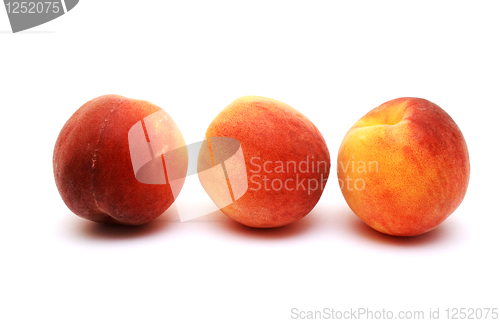 Image of Foto of peaches placed on white background