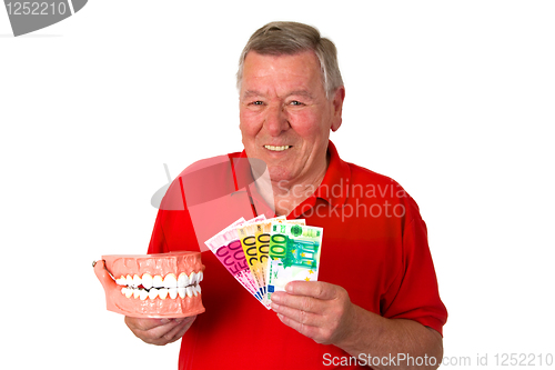 Image of Senior with teeth model