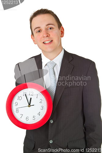 Image of Young businessman holding a clock