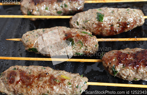 Image of Lamb Kofta on a grill plate