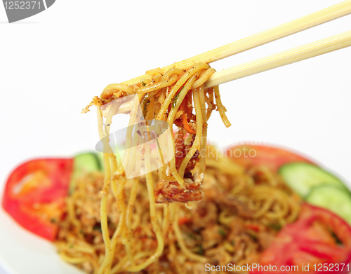 Image of Eating noodles with chopsticks