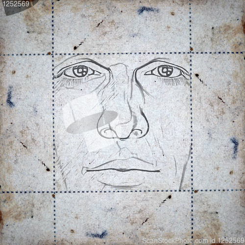 Image of face on stained paper