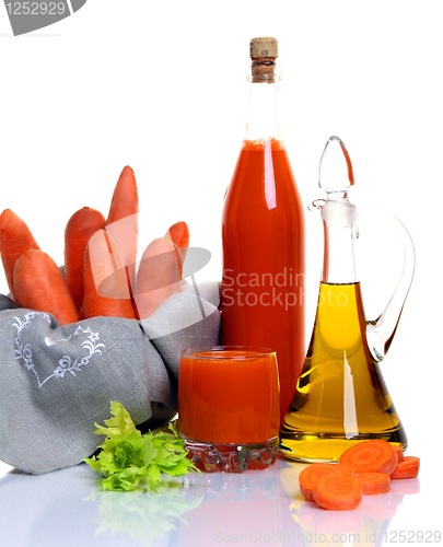 Image of Fresh raw carrot and vegetable juice.