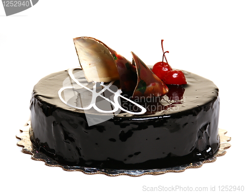 Image of Chocolate cake decorated with cherries.