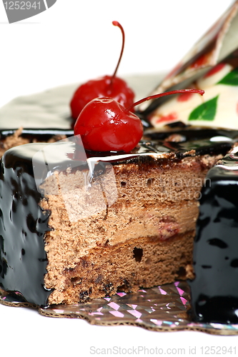 Image of Chocolate cake decorated with cherries.