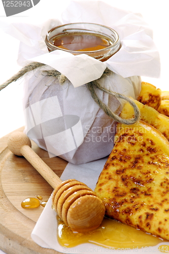 Image of Pancakes with honey.