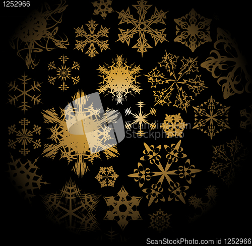 Image of Golden snowflakes on black background