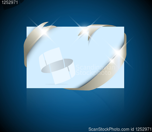 Image of Christmas or wedding card - silver ribbon around blank blue paper