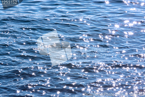 Image of sparkling lights on blue water