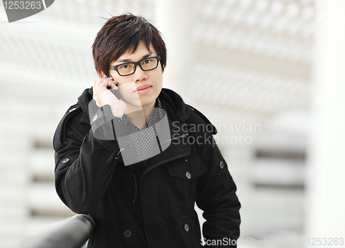 Image of man talking on mobile phone