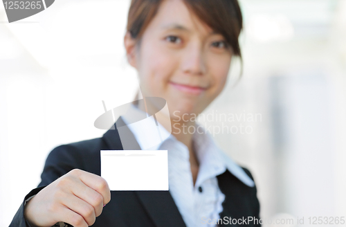 Image of business woman showing blank card