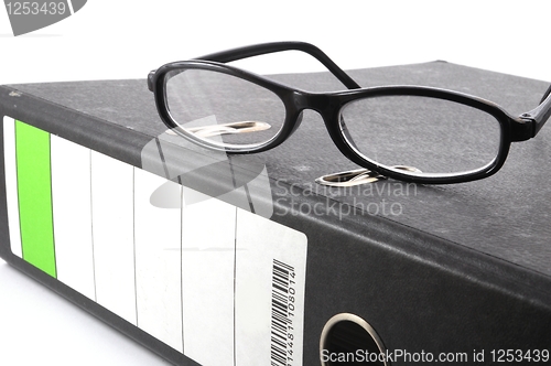 Image of eye glasses and folder