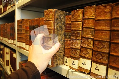 Image of old books in a library