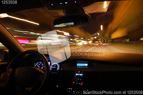 Image of night drive with car in motion 