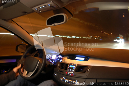 Image of car in motion at night