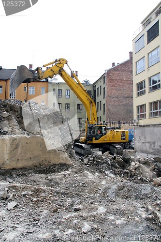 Image of Yellow excavator in action
