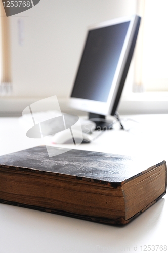 Image of books and computer