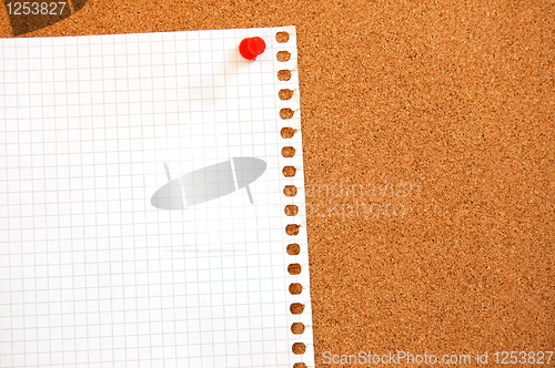 Image of empty sheet paper with push pin