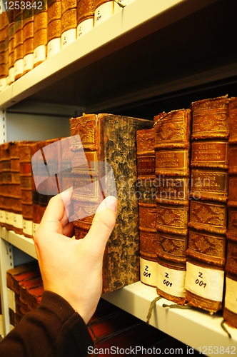 Image of old books in a library