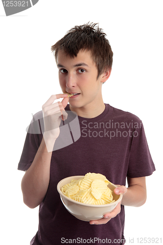 Image of Boy eating potato crisps