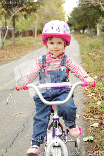 Image of Little girl on bicycle