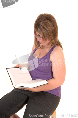 Image of Young girl reading book.